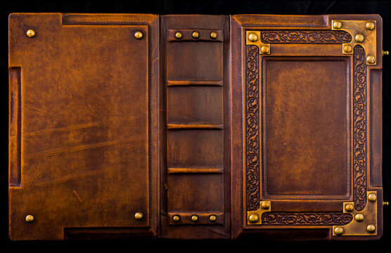 Opened leather book cover, rich decorated with metal corners