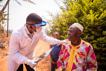 African doctor visits an elderly patient and they converse during the medical examination. Health care in africa concept - obrazy, fototapety, plakaty