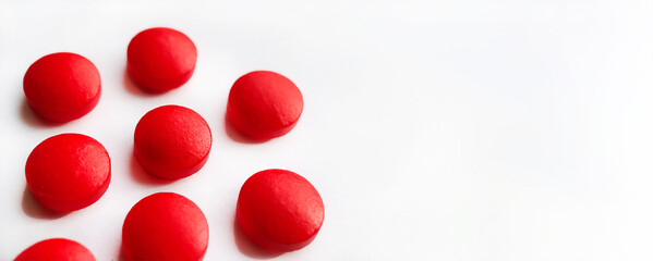 Selective focus, group of red medical pills isolated on white background.Health and medicine concept