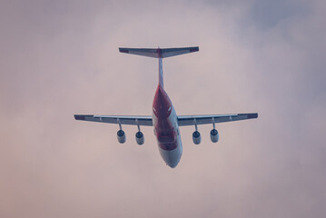 Fire fighting air tanker fly through smoke from a wildfire