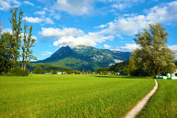 Fototapeta na wymiar Beautiful Austrian Landscape with Field, Mountains and Pathway. Bad Goisern, Upper Austria. 