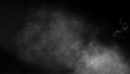 Smoke flowing on black background for Halloween or tough overlay and texture.