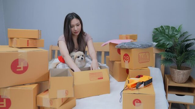 Business concept of 4k Resolution. Asian woman checking customer orders at home.