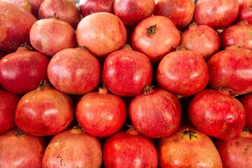 Fototapeta na wymiar Ripe and juicy Turkish pomegranate close-up. High quality organic products. High quality photo