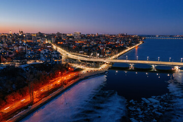 Fototapeta na wymiar Night winter Voronezh. Massalitinov embankment and Chernavsky bridge, aerial view