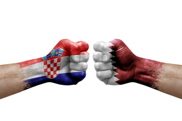 Two hands punch to each others on white background. Country flags painted fists, conflict crisis concept between croatia and qatar