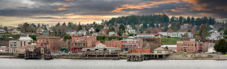 Port Townsend, Washington Waterfront Skyline. Panoramic view of the historic waterfront and downtown area of this port city. Noted for its Victorian houses and significant historical buildings. - 489289981