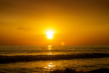 Beautiful sunset over the sea with orange sky