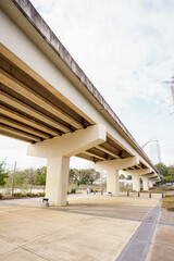 Park scene under a vehicle bridge