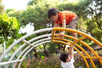 two brother playing on the playground together