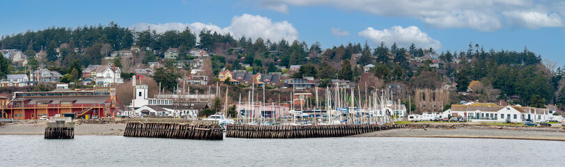 Port Townsend, Washington Waterfront Skyline. Panoramic view of the historic waterfront and downtown area of this port city. Noted for its Victorian houses and significant historical buildings. - obrazy, fototapety, plakaty