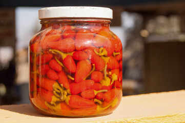 Large bottle of red peppers sits at a roadside stand in Baha Mexico