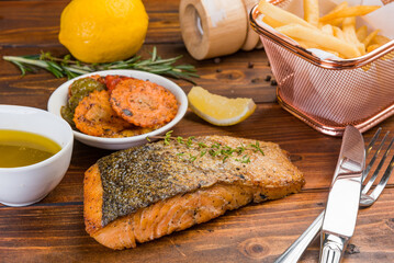 salmon steak on wood background, healthy food