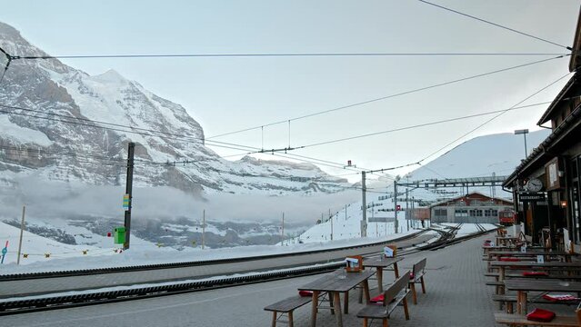 Empty Restaurant Terrace tables in the Swiss Alps, Kleine Scheidegg, Switzerland. Jungfrau Region in the winter with no people.