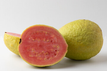 Whole and half ripe guava.