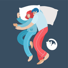 Cute young couple lying in bed and cuddling, view from the top.