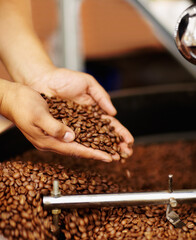 Ready for the grind. Cropped shot of hands cupping coffee beans waiting to be ground.