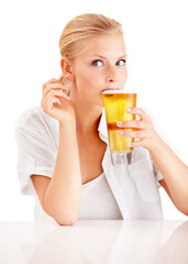 Get refreshed. Shot of a young woman enjoying a drink.