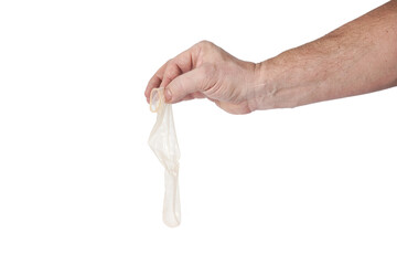 Hand holds a condom on a white background - 489304555