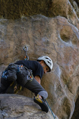 Rock Climber climbing the route La Presuda in Suesca Colombia