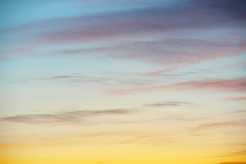 Clouds in the sky are illuminated from below by the light of the sun. Beautyfull sky wallpaper and background. Sunset or sunrise scene at dusk.