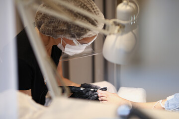 Lady cleaning persons feet
