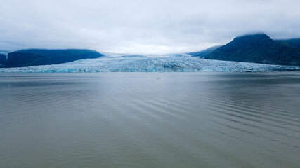Obraz premium Beautiful Aerial view of the massive Glacier in Iceland and its lagoon caused by global warming -Svinafellsjokull - Jökulsárlón