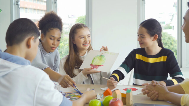 A group of multi ethnic of students kids and teachers study, learn art painting, drawing in school. Education in classroom. People lifestyle