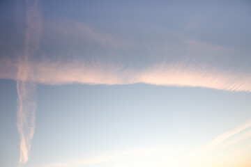 Fototapeta premium Traces of planes in the sky, exhaust fumes in nice lines on a blue background. Airplane traces.