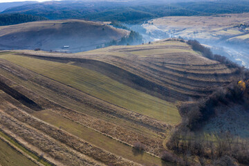 Fototapeta premium Aerial view of a small countryside village in the autumn