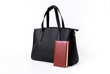 A black leather bag shows what you can hold on a white background