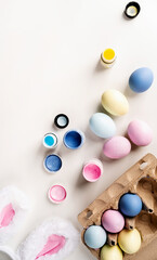 easter background with eggs with pastel paints, top view flat lay