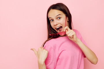 positive woman pink glasses and t-shirt hand gesture isolated background