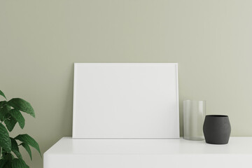 Minimalist and clean horizontal white poster or photo frame mockup on the white table leaning against the room wall with vase and plant