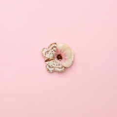 Minimal spring card composition background with butterfly on flower