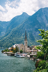 Fototapeta na wymiar Hallstatt historic town by lake in the Alps in Austria in summer