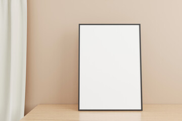 Minimalist and clean vertical black poster or photo frame mockup on the wooden table in living room