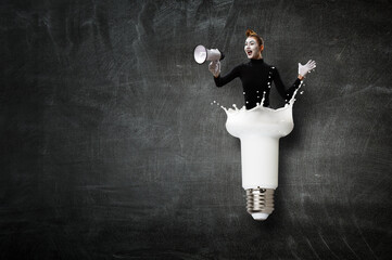 Female mime with loud speaker