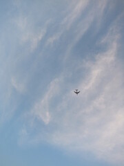 air plane in the sunset color sky