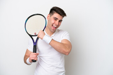 young tennis player man isolated on white background celebrating a victory