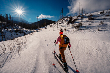 Mountaineer backcountry ski walking ski alpinist in the mountains. Ski touring in alpine landscape...