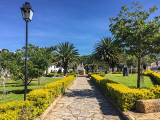 Path leading to a statue in the Antonio Nariño Park in the center of Villa de Leyva, Colombia