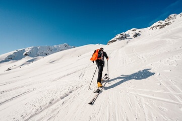 Ziarska dolina, slovakia, 10.2.2022. Mountaineer backcountry ski walking ski alpinist in the mountains. Ski touring in alpine landscape with snowy trees. Adventure winter sport. © Zedspider