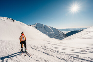 Ziarska dolina, slovakia, 10.2.2022. Mountaineer backcountry ski walking ski alpinist in the mountains. Ski touring in alpine landscape with snowy trees. Adventure winter sport. © Zedspider