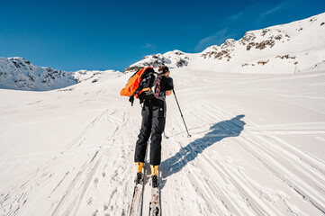 Ziarska dolina, slovakia, 10.2.2022. Mountaineer backcountry ski walking ski alpinist in the mountains. Ski touring in alpine landscape with snowy trees. Adventure winter sport. © Zedspider