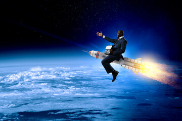 Fototapeta na wymiar Businessman on a rocket . Mixed media