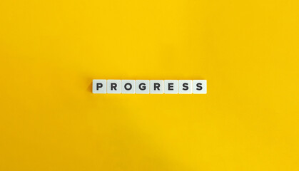 Progress Word on Letter Tiles on Yellow Background. Minimal Aesthetics.