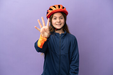 Little caucasian girl isolated on purple background happy and counting four with fingers