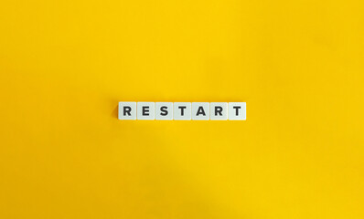 Restart Word on Letter Tiles on Yellow Background. Minimal Aesthetics. - obrazy, fototapety, plakaty
