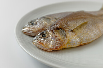 dried yellow croaker on a white background